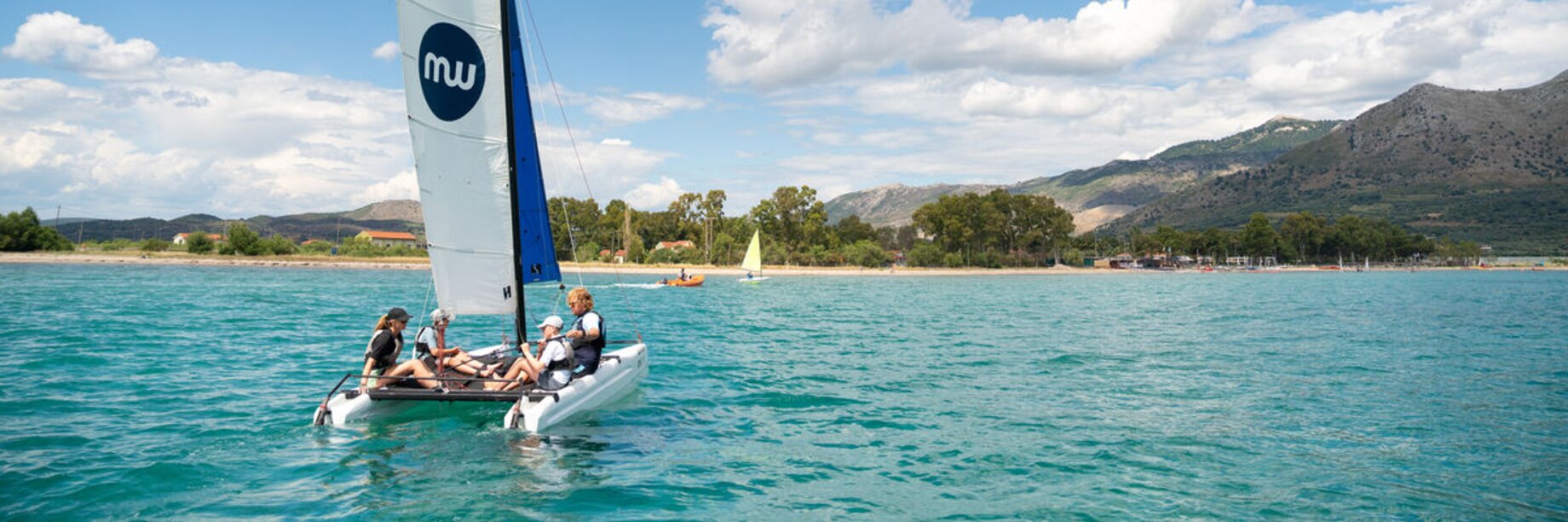 A family sailing at Paleros Beach Resort
