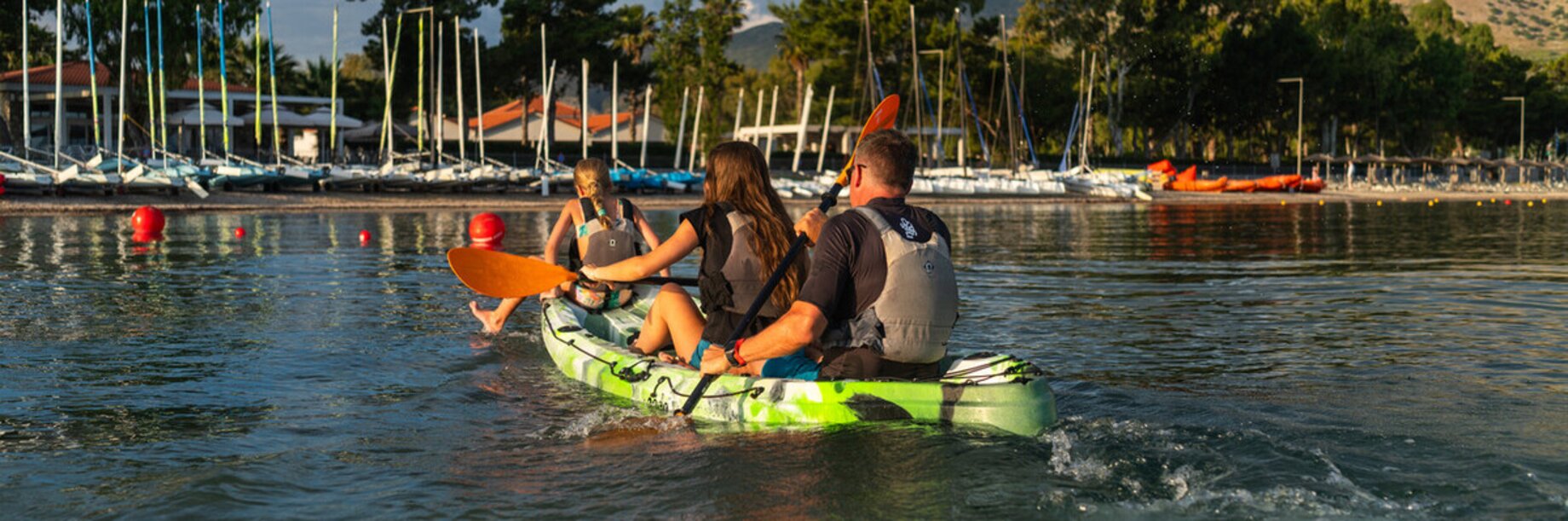 Two person kayak coming into the beach