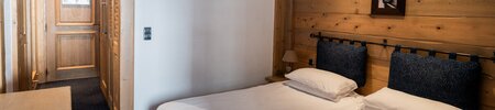 Twin beds at Chalet Hotel L'Ecrin