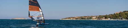 Windsurfer foiling at Phokaia Beach Resort, Turkey