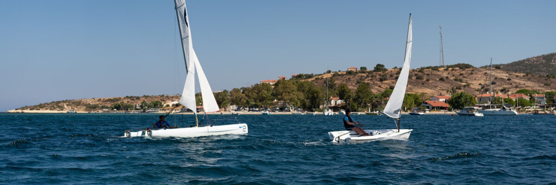 A catamaran and a dinghy sailing boat at Phokaia Beach Resort, Turkey