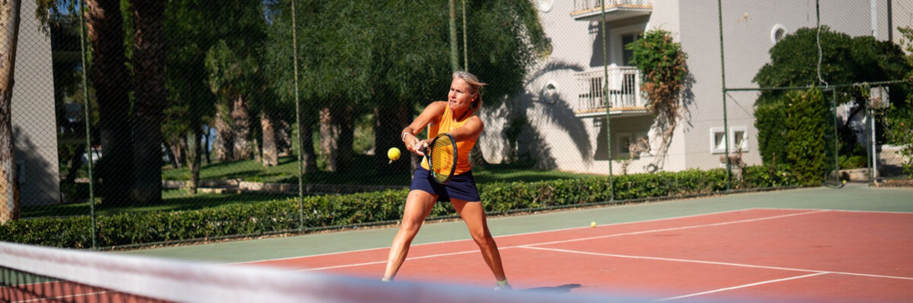 A woman playing tennis at Phokaia Beach Resort, Turkey