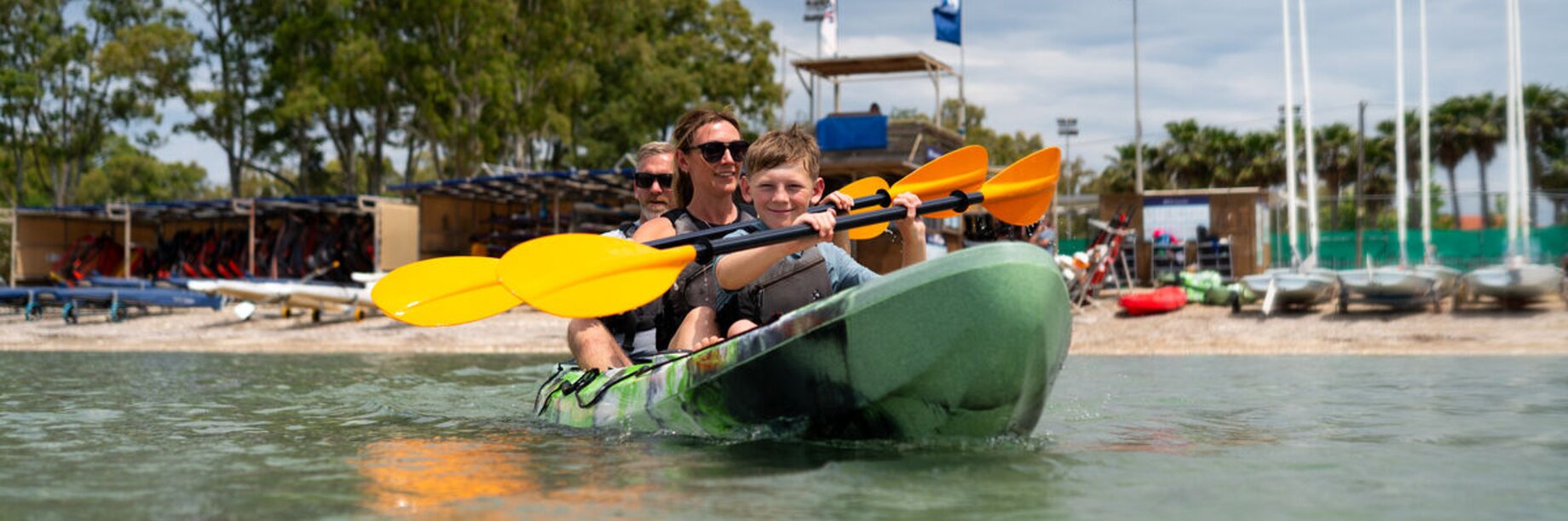 A family in a kayaking at Paleros Beach Club, Greece