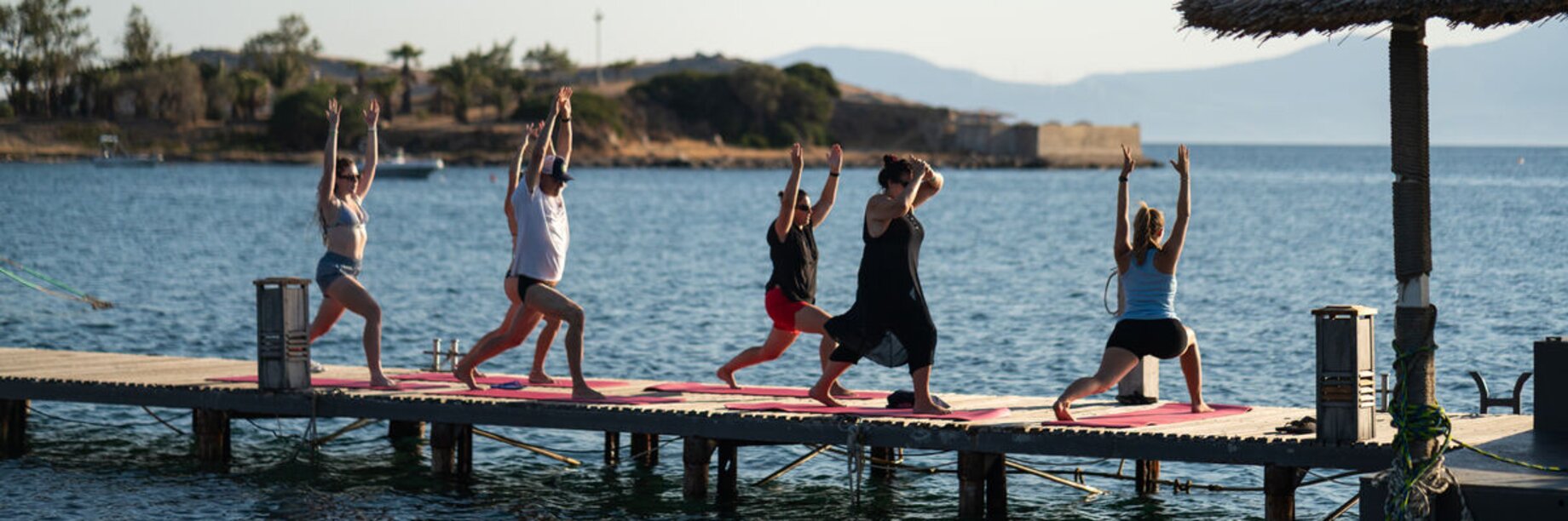 A yoga class on the jetty at Phokaia Beach Resort, Turkey