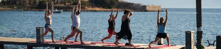 A yoga class on the jetty at Phokaia Beach Resort, Turkey