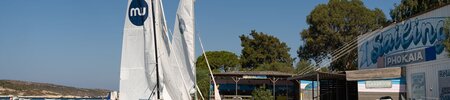 Waterfront with dingy sailing boats at Phokaia Beach Resort, Turkey