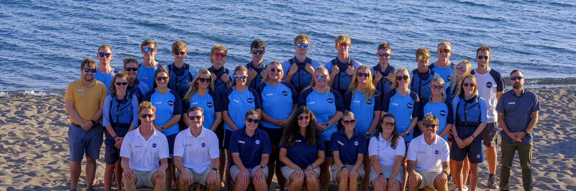 Aeolian Village Summer 25 team on the beach