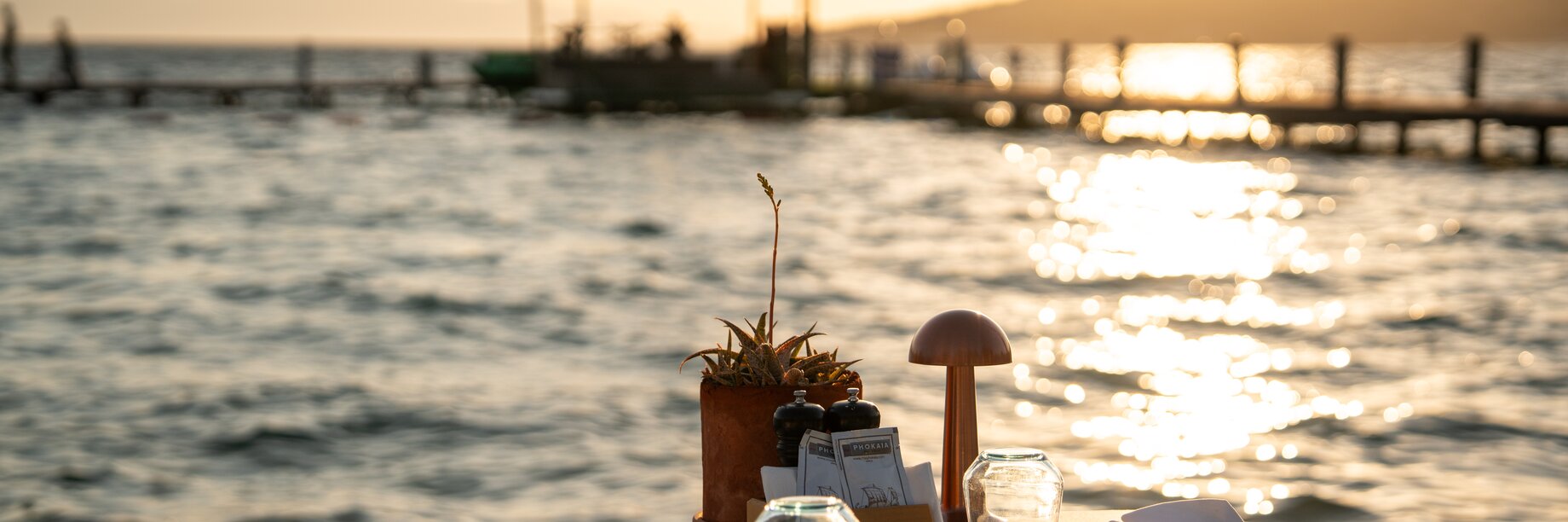 Agave restaurant at sunset with Jetty in the background, Phokaia Beach Resort