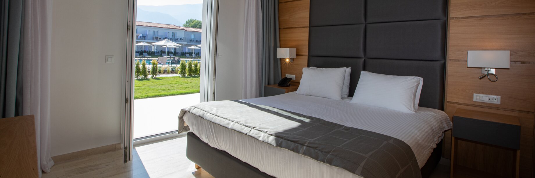 a bedroom with a large window