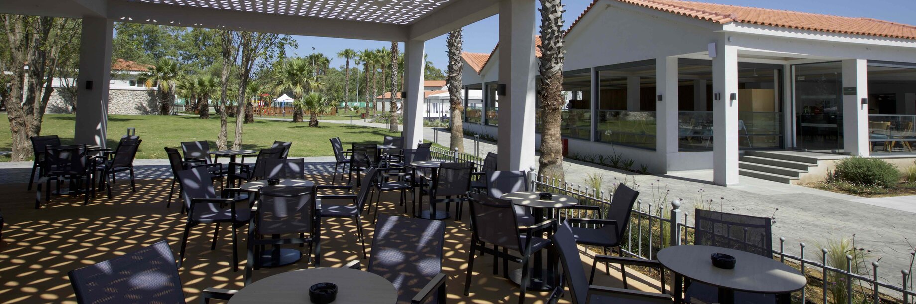 a patio with tables and chairs