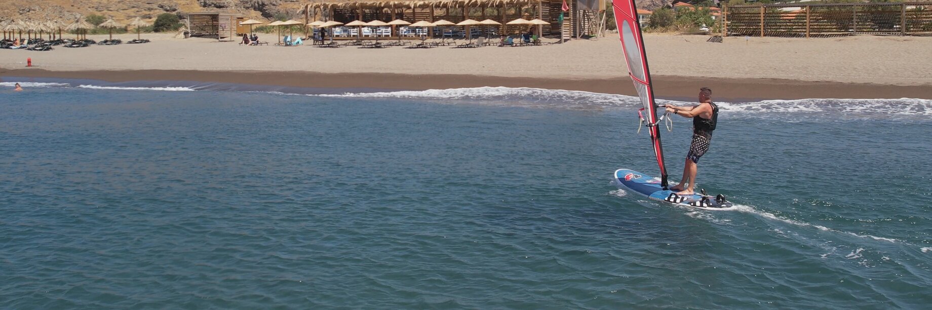 a man on a surfboard in the ocean