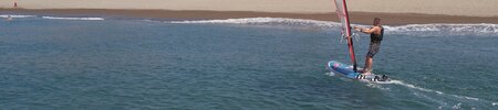 a man on a surfboard in the ocean