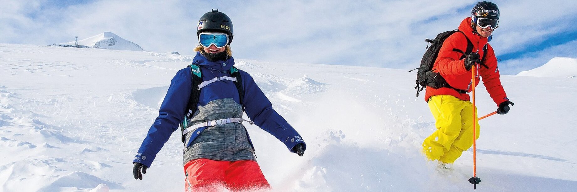 a couple of people hiking in the snow