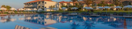 Sunrise at Aeolian Village Beach Resort, Lesvos with a view of the hotel rooms and main pool