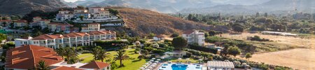 Drone view of Aeolain Village Resort up to the village rooms and beyond